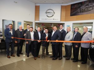 Springfield mayor Alex Keiser cuts the first ribbon with members of EMACC, Nick Ianelli, Isaac Weiner, Jeffrey Weiner, Michael Ianelli, Mike Ianelli Jr., Rich Willis GM